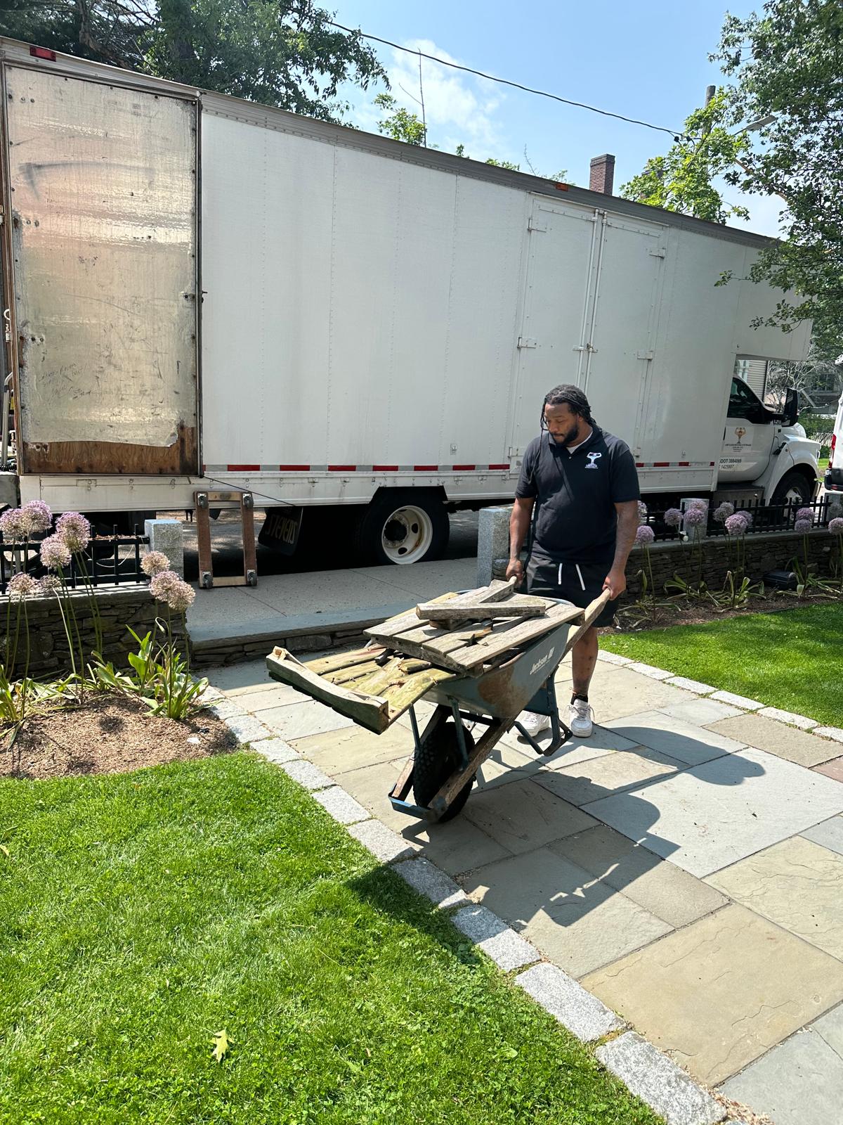 Junk removal and cleanout crew loading unwanted items in Greater Boston